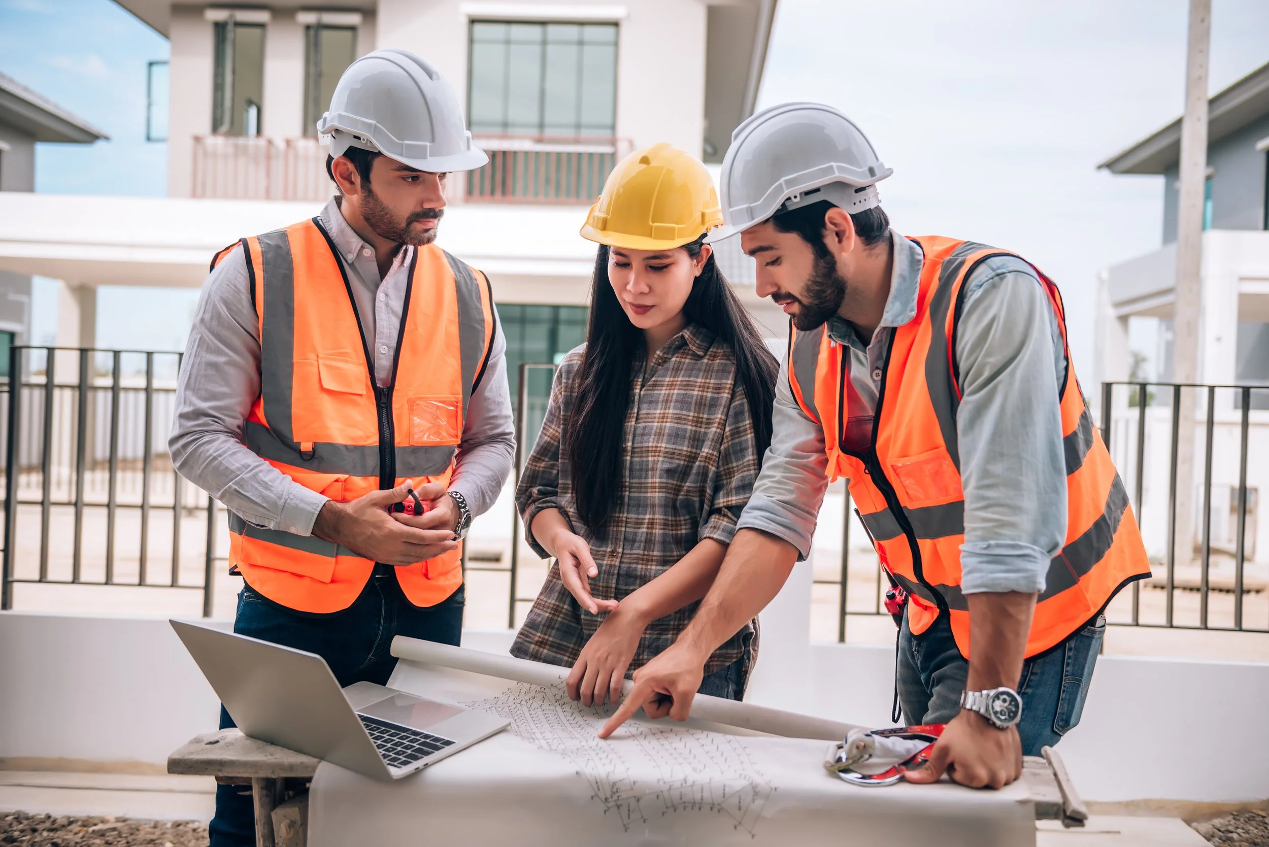 civil-engineer-construction-worker-architects-wearing-hardhats-safety-vests-are-working-together-construction-site-building-home-cooperation-teamwork-concept.jpg