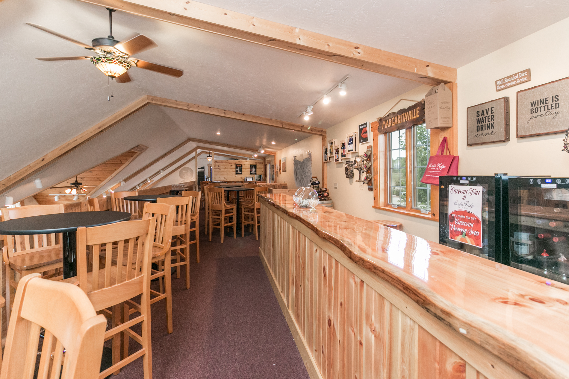   Our Log Loft upstairs is the perfect place to relax and unwind with a glass of wine and cheese, and yes, “solve the world’s problems one sip at a time.”  