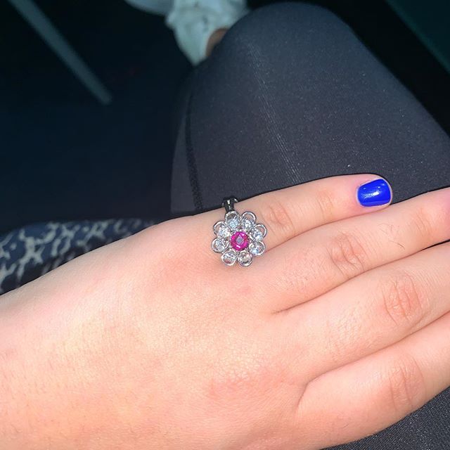 Custom refurbished ballerina ring with diamonds surrounding a center ruby