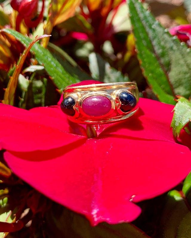 Beautiful 14k gold with a center Cabochon ruby hugged by two Cabochon sapphires. Dm for further details and pricing