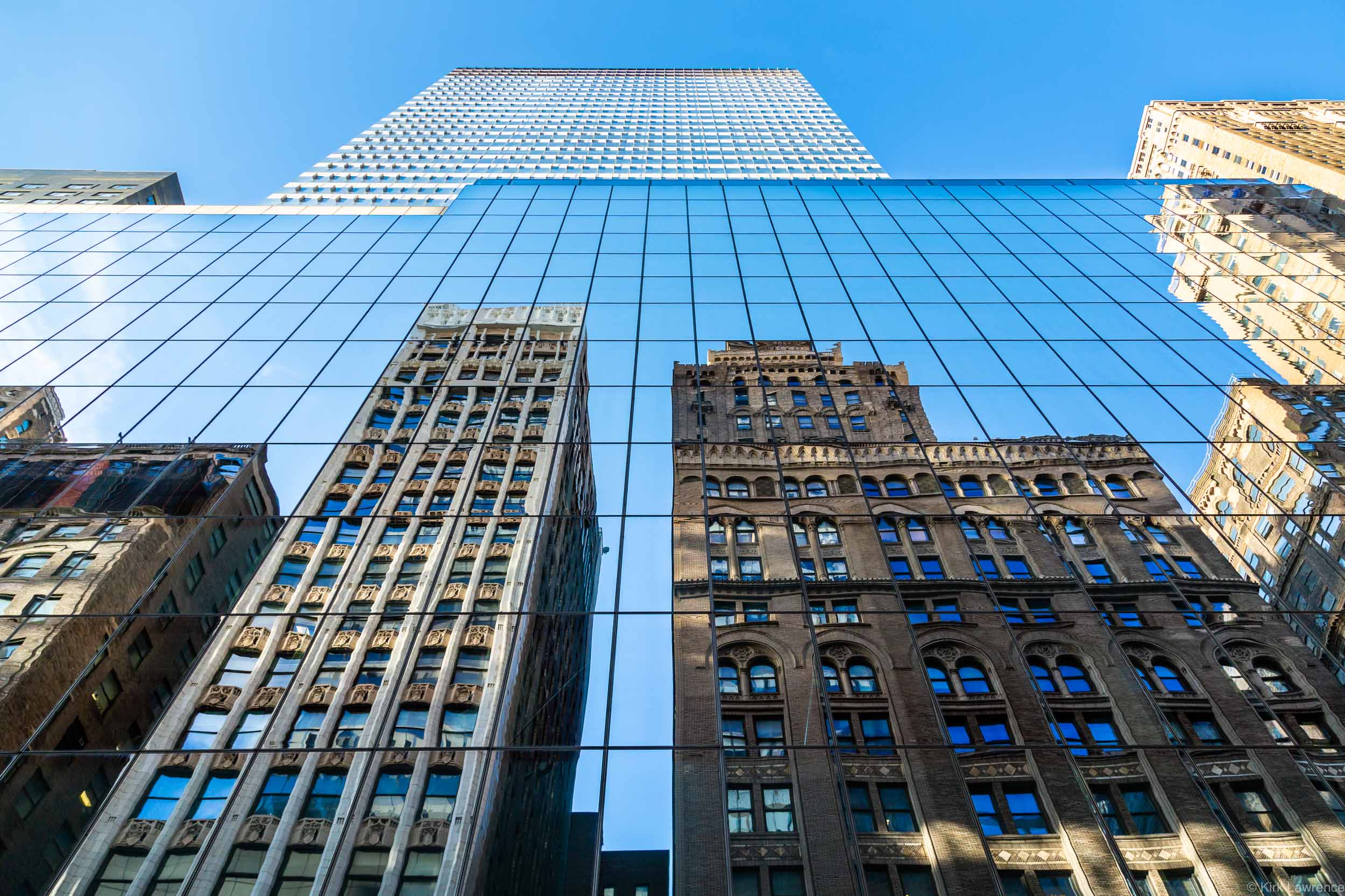 reflection_skyscraper_New_York_City_blue_sky.jpg