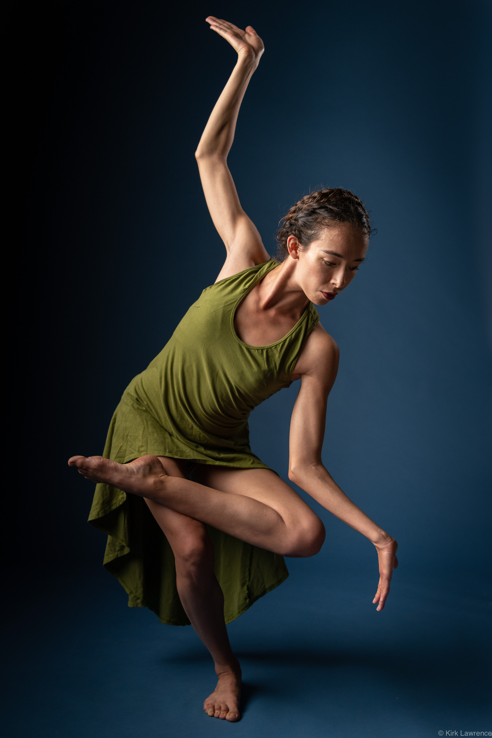 modern_dancer_balancing_green_dress_portrait.jpg