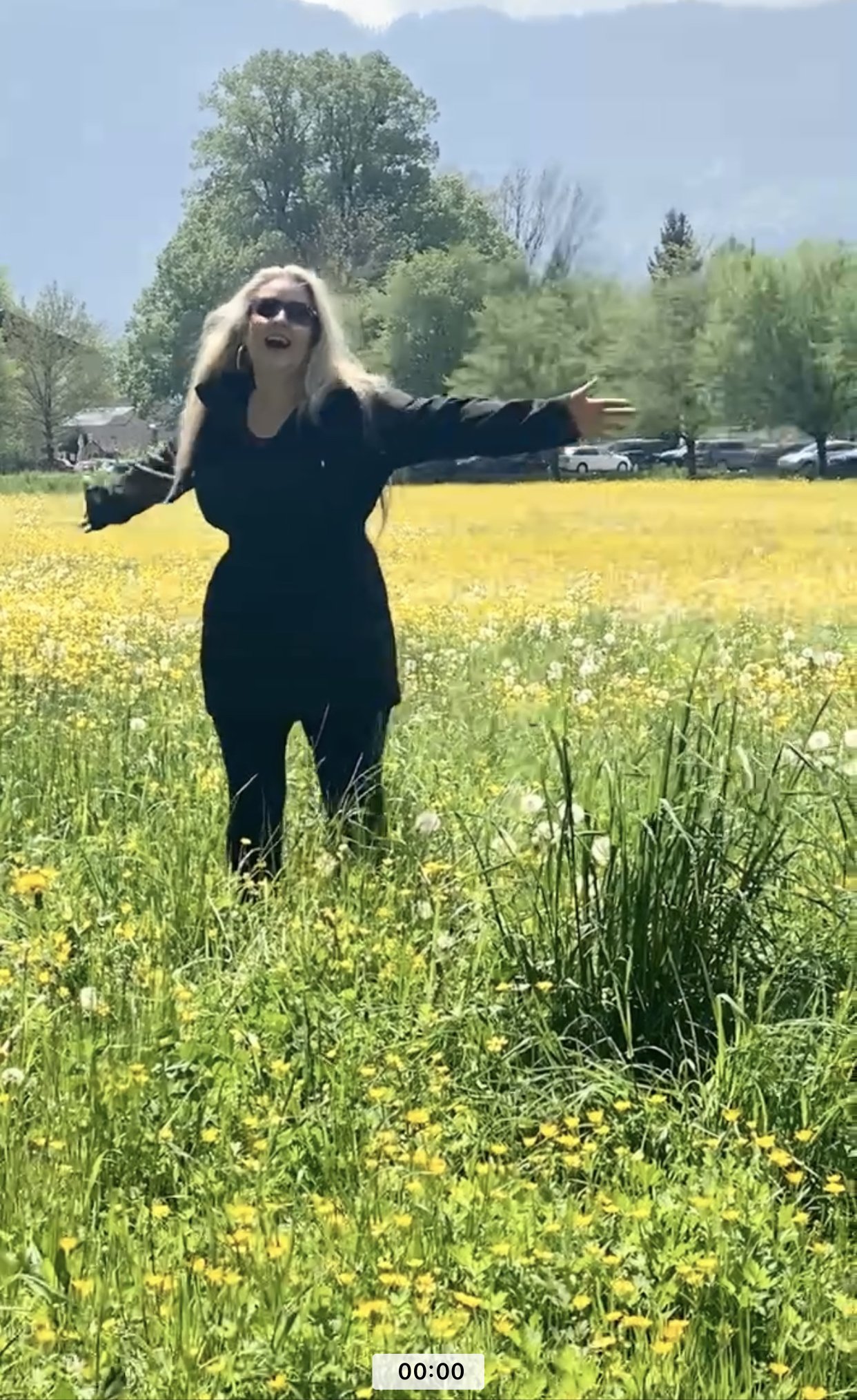 Me twirling in a field of flowers just like Fraulein Maria