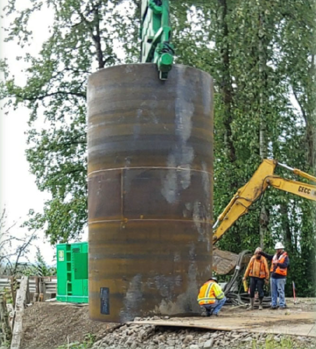 This pier casing is installed prior to the rebar cage going in and has two jobs: 1) Keep concrete in, and 2) Keep soil out.