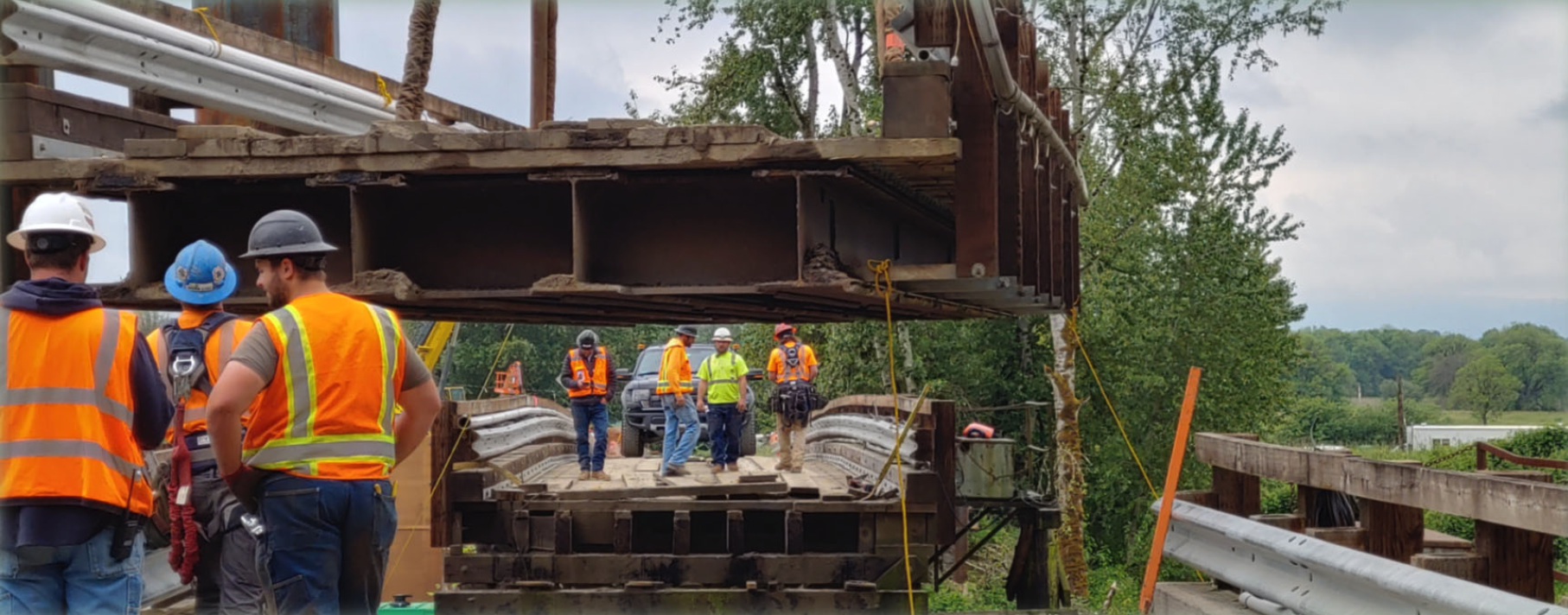 Crews remove the center span of the existing bridge to barge in a crane to work on the new bridge. Did you even know the old bridge could do that?! Don’t worry about driving across it on the weekends, though. The old bridge was designed to have the center span removed for large vessels to pass.