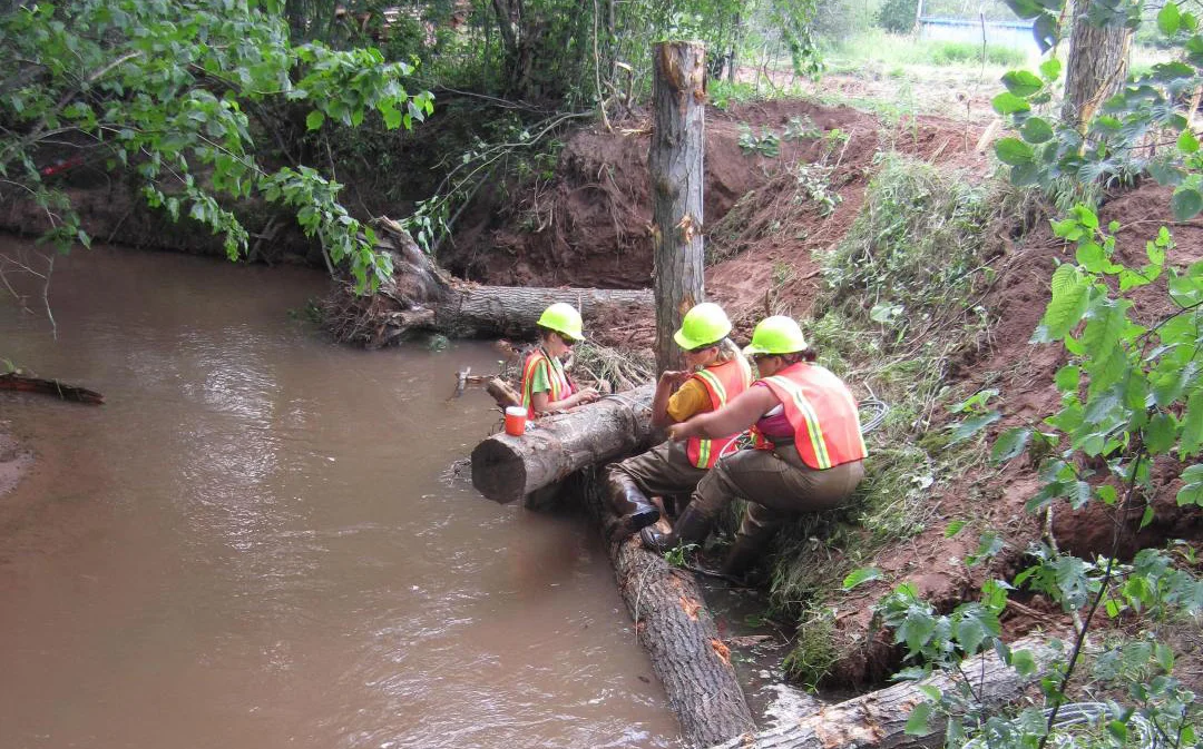An example of placing woody debris in a stream restoration project. Photo by Inter-Fluve, Inc.