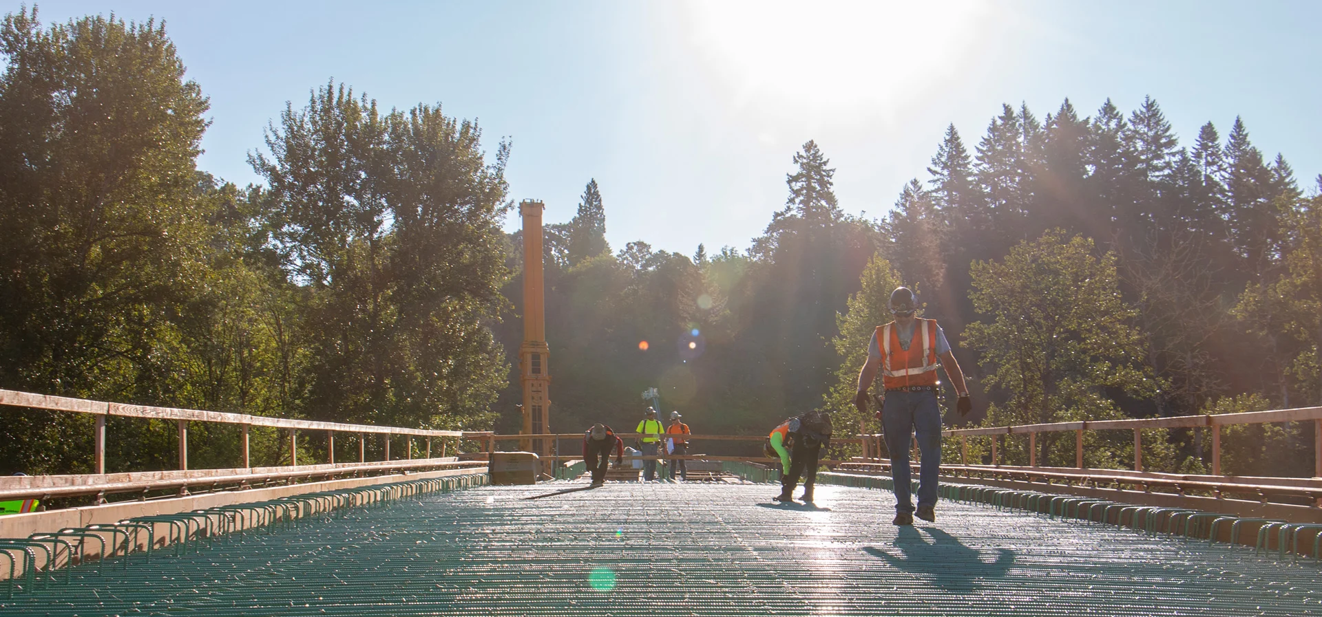 Crews tie rebar on the bridge deck before pouring the concrete surface.