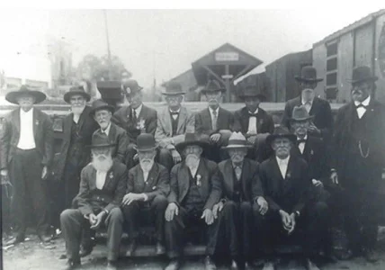 Pictured here standing on the back row, third from left is Charles Hicks posing with fellow veterans at the train station in Lyons, Georgia. This would be Charles’ final trip to Gettysburg.