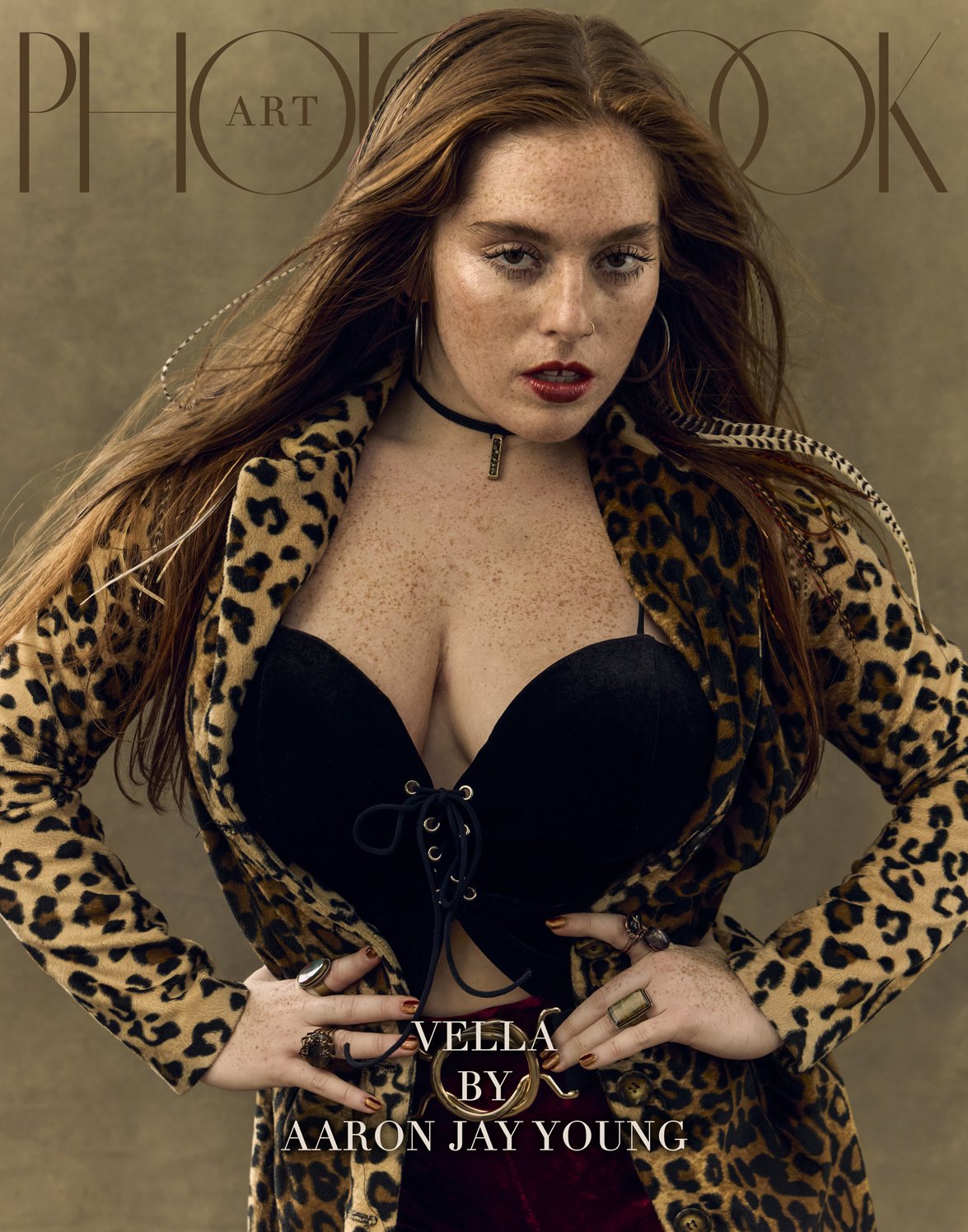 Vella is wearing leopard jacket + corset.