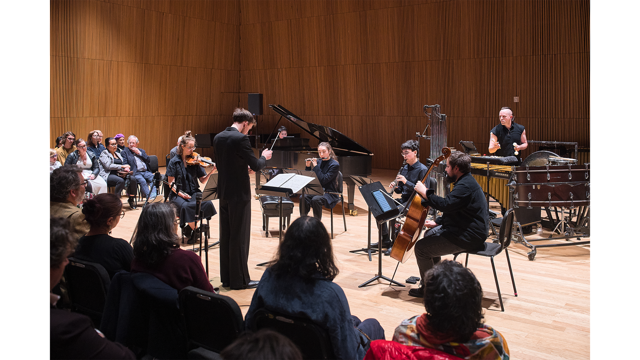 Audience watching the ensemble perform.