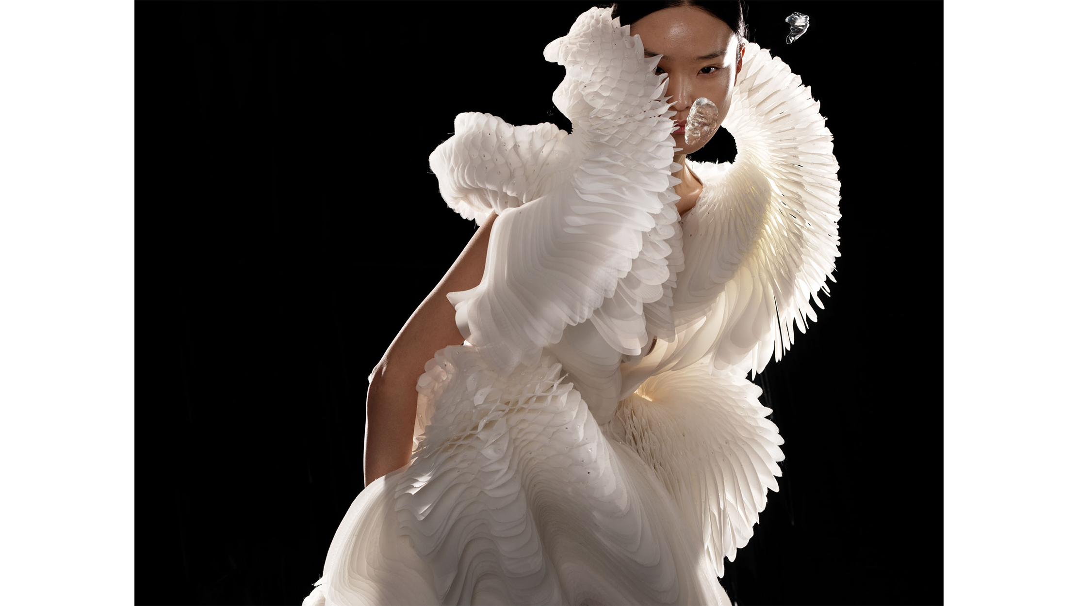 Image of model in white dress.