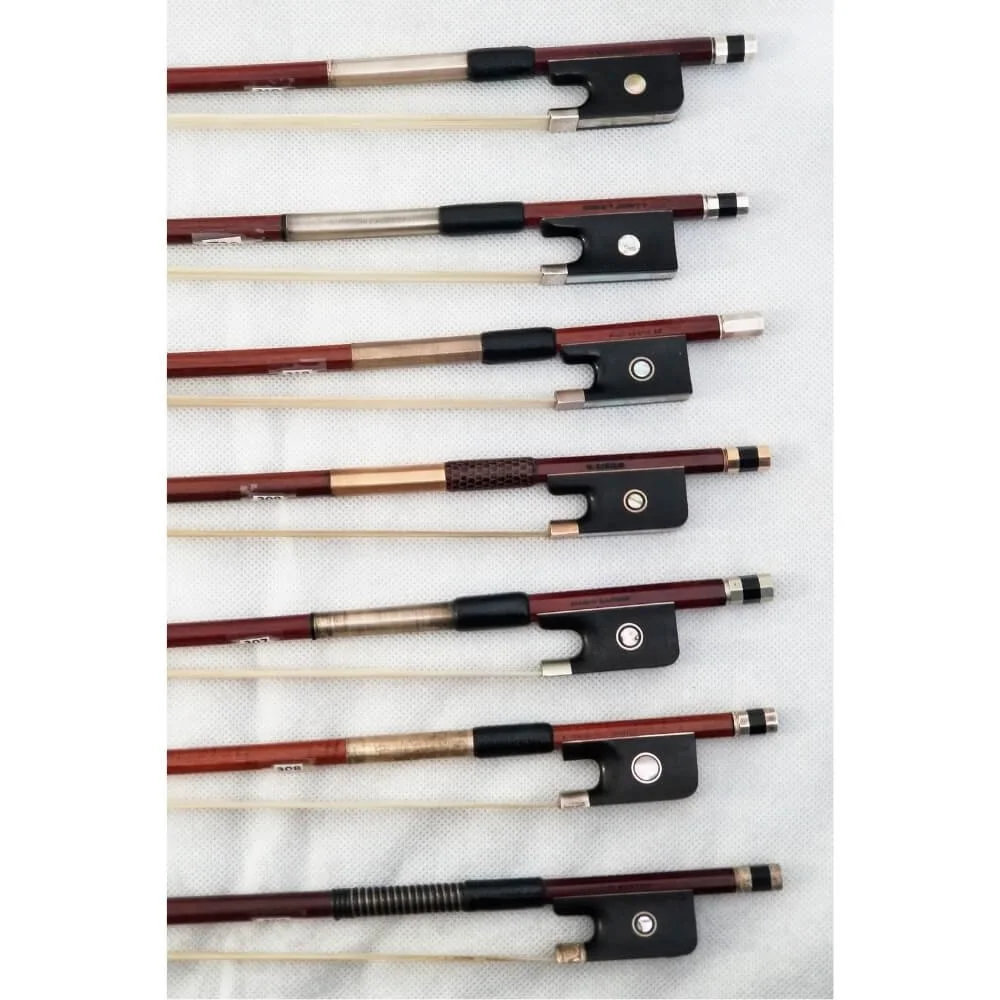 A collection of viola bows for sale in Boston by various makers.