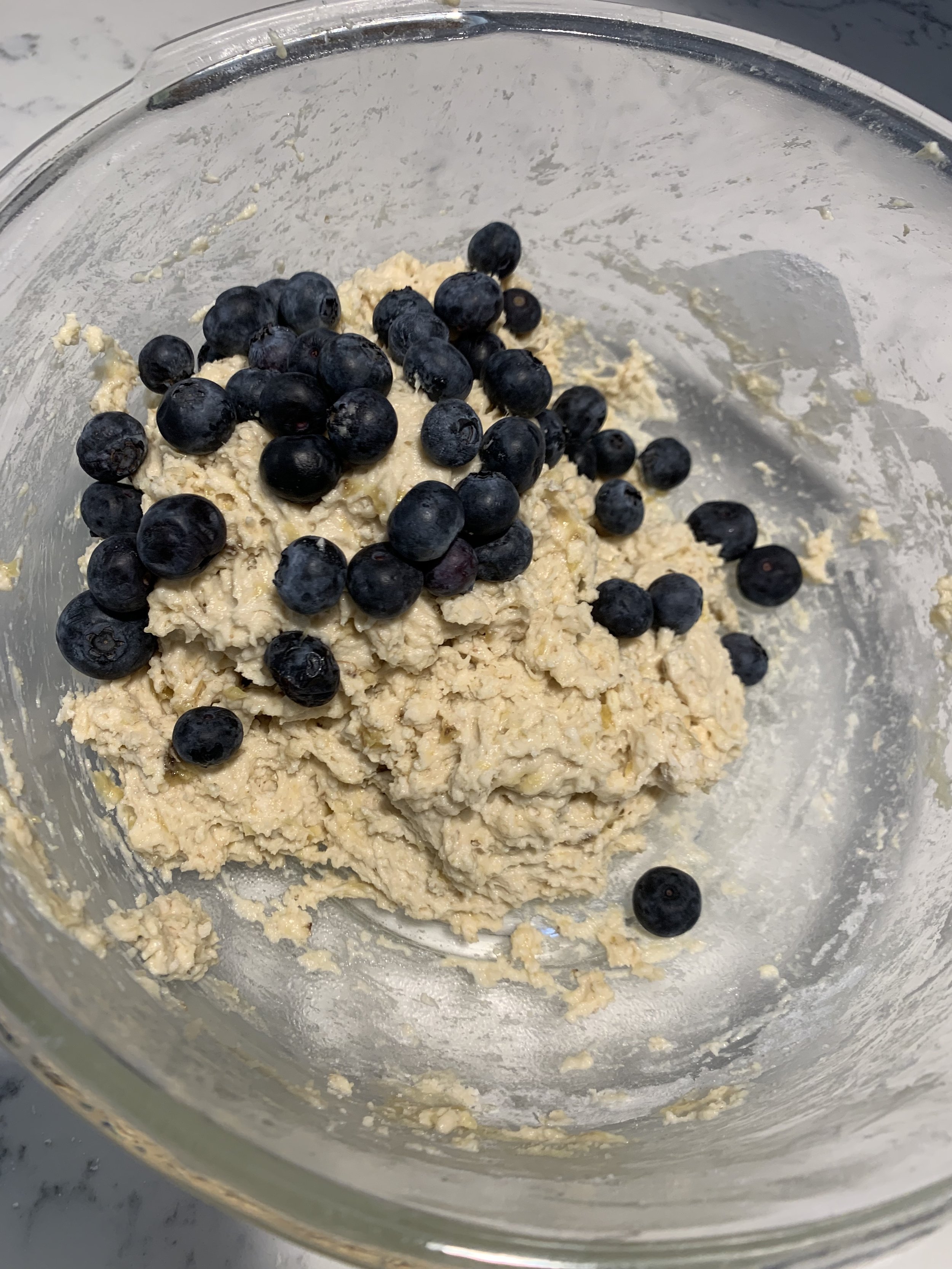 Fold in the blueberries with a rubber spatula so they don’t burst in the dough.