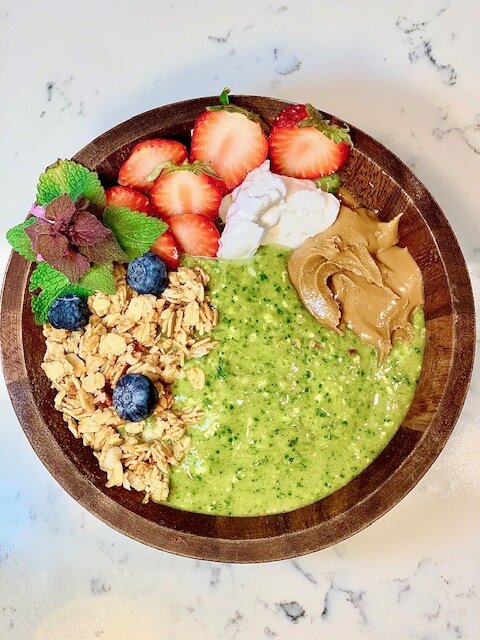 The Happy Camper: 1 cup spinach, 1 apple, 1 banana, 1/2 cup pineapple, 1/2 cup frozen coconut, 1 scoop Nuzest matcha vanilla protein powder , 1/2 cup almond milk. Topped with sunflower butter, vegan yogurt, strawberries, blueberries, and vanilla granola.