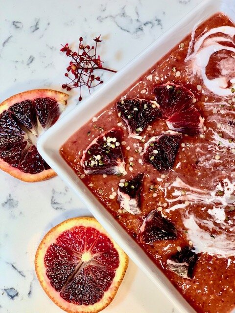 The Dreamcicle: 1/2 cup cherries, 1 banana, 1 carrot, 1 scoop Nuzest vanilla probiotic protein powder , 1/2 cup almond milk, topped with blood oranges, vanilla vegan yogurt, and hemp hearts.