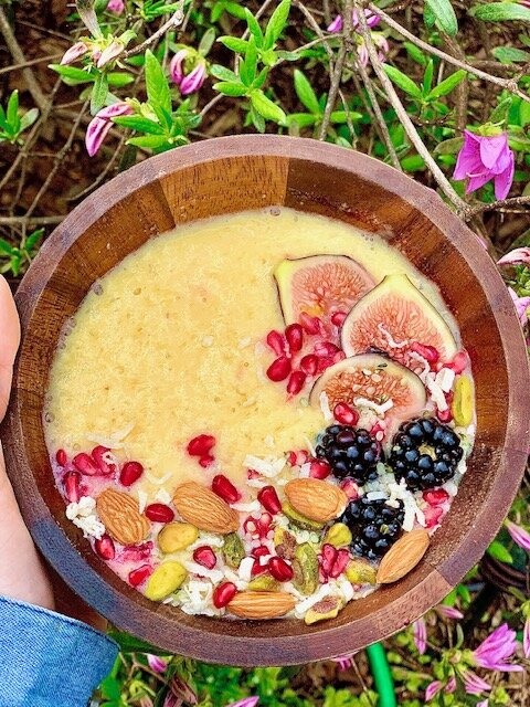 The Summertime: 1/2 frozen mango, 1/2 cup frozen pineapple, 1 banana, 1/2 cup yellow summer squash, 1/3 cup soy milk, topped with fresh figs, pomegranate seeds, blackberries, pistachios coconut shreds, and hemp hearts.