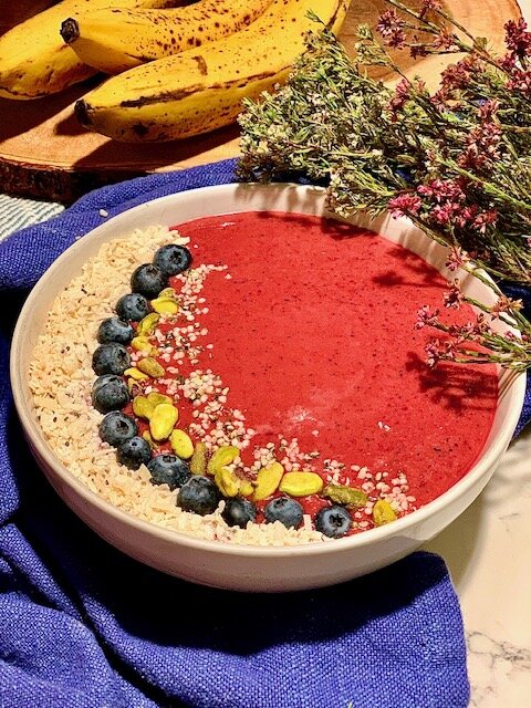 The Powerhouse: 1 1/2 frozen bananas, 2 strawberries, 5 cherries, 1/4 cup spinach, 10 blueberries, 1/2 apple, 1 tsp flax meal, 1/2 cup roasted butternut squash, 1 raw carrot, 1/4 cup raw beet, 3/4 cup vanilla coconut milk, topped with raw pistachios, chia seeds, blueberries, hemp hearts, and coconut shreds.