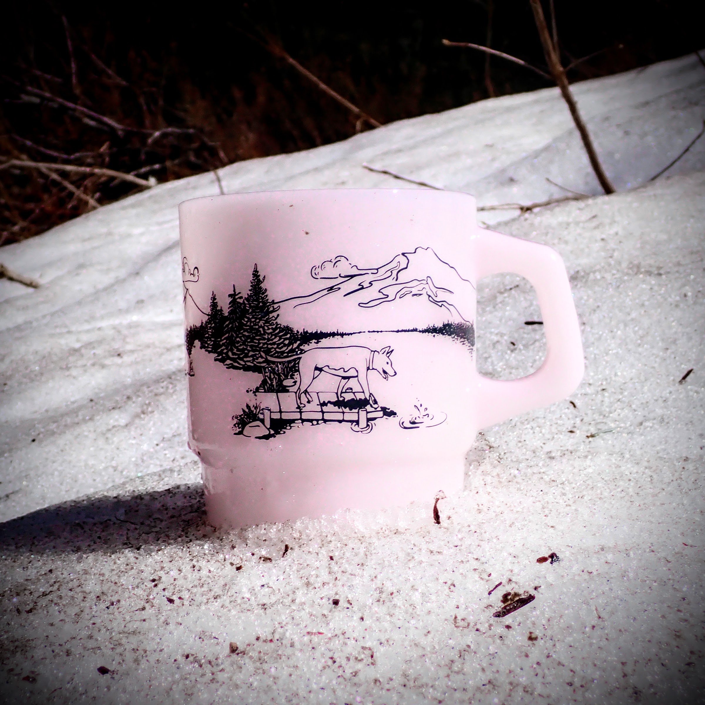Other side of our Milk Glass Mug in Pink showing Tonx the Trail Dog watching a stone fall into the water