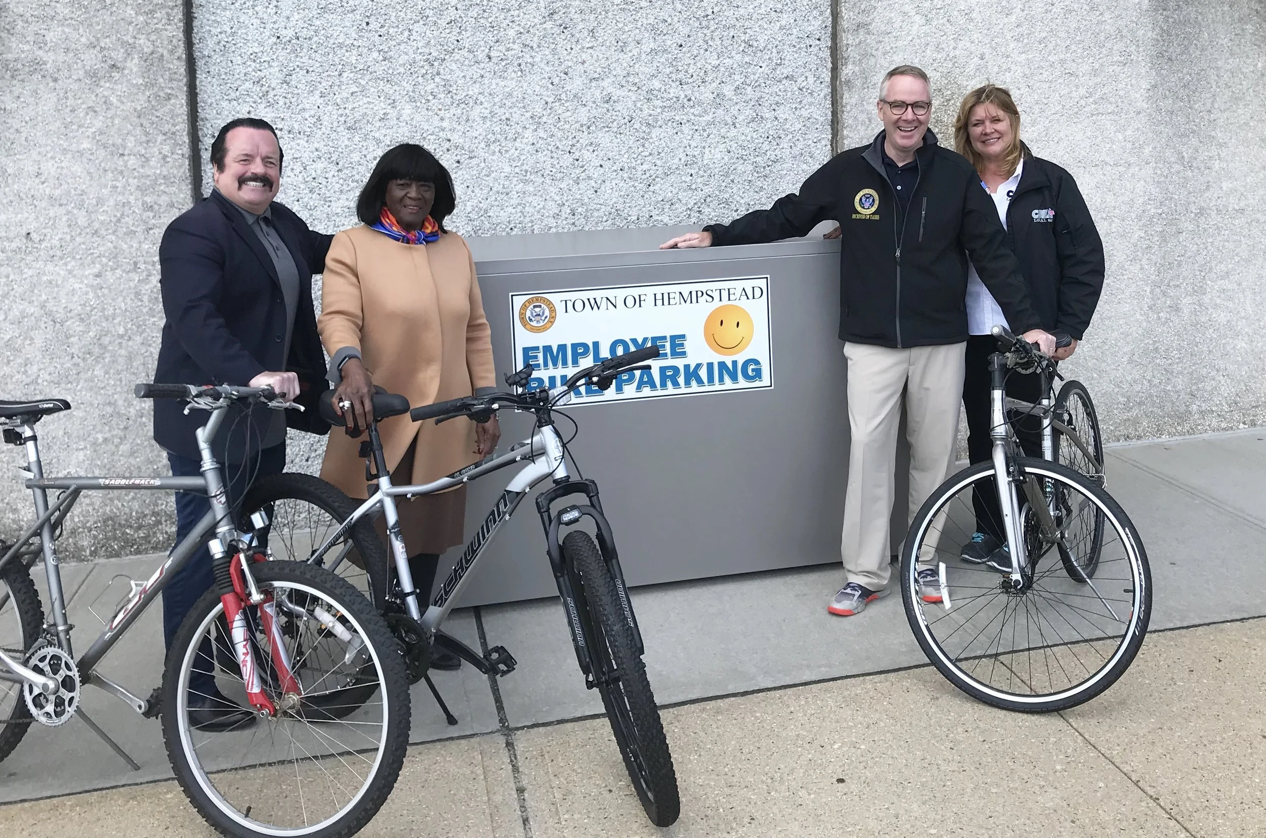 Don Clavin (2nd right) with Senior Councilwoman Dorothy Goosby (2nd left), CSEA Local 880 President Theresa Kohutka (right) and Public Safety Department Employee Ed Powers (left) during a National Employee Health and Fitness Month event. Clavin unveiled new bike lockers to help promote healthy lifestyles for town workers.