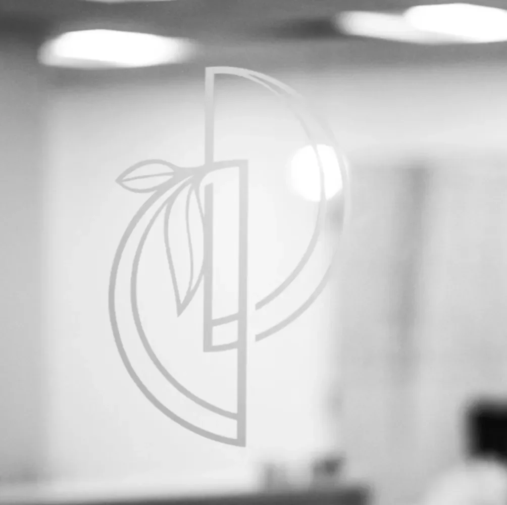 DeRosa Dermatology Logo on glass office door