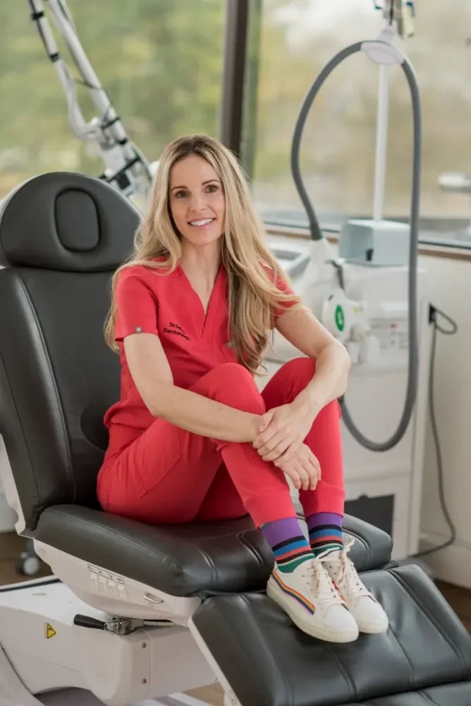 Dr. Ivy DeROsa seated in her cosmetic exam room in Bucks County PA