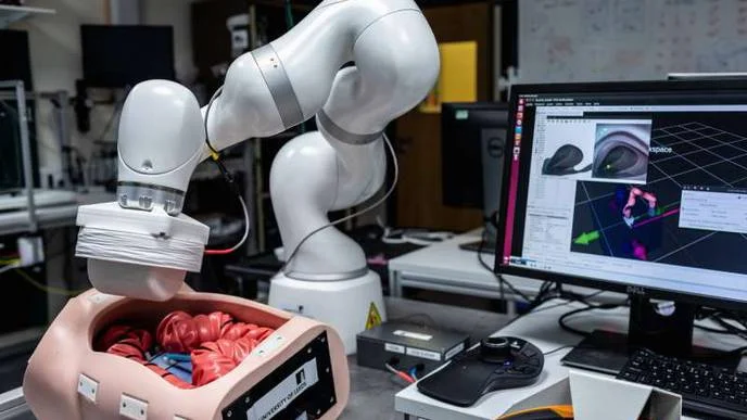 Picture of the robotic arm over a dummy Image courtesy of ReachMD