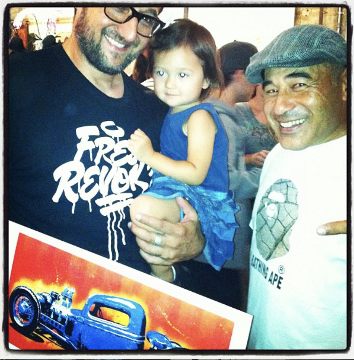Me, my daughter, Love, and Stevie with one of his early prints at a show we both exhibited in at CUKUI Gallery in San Jose in 2011.