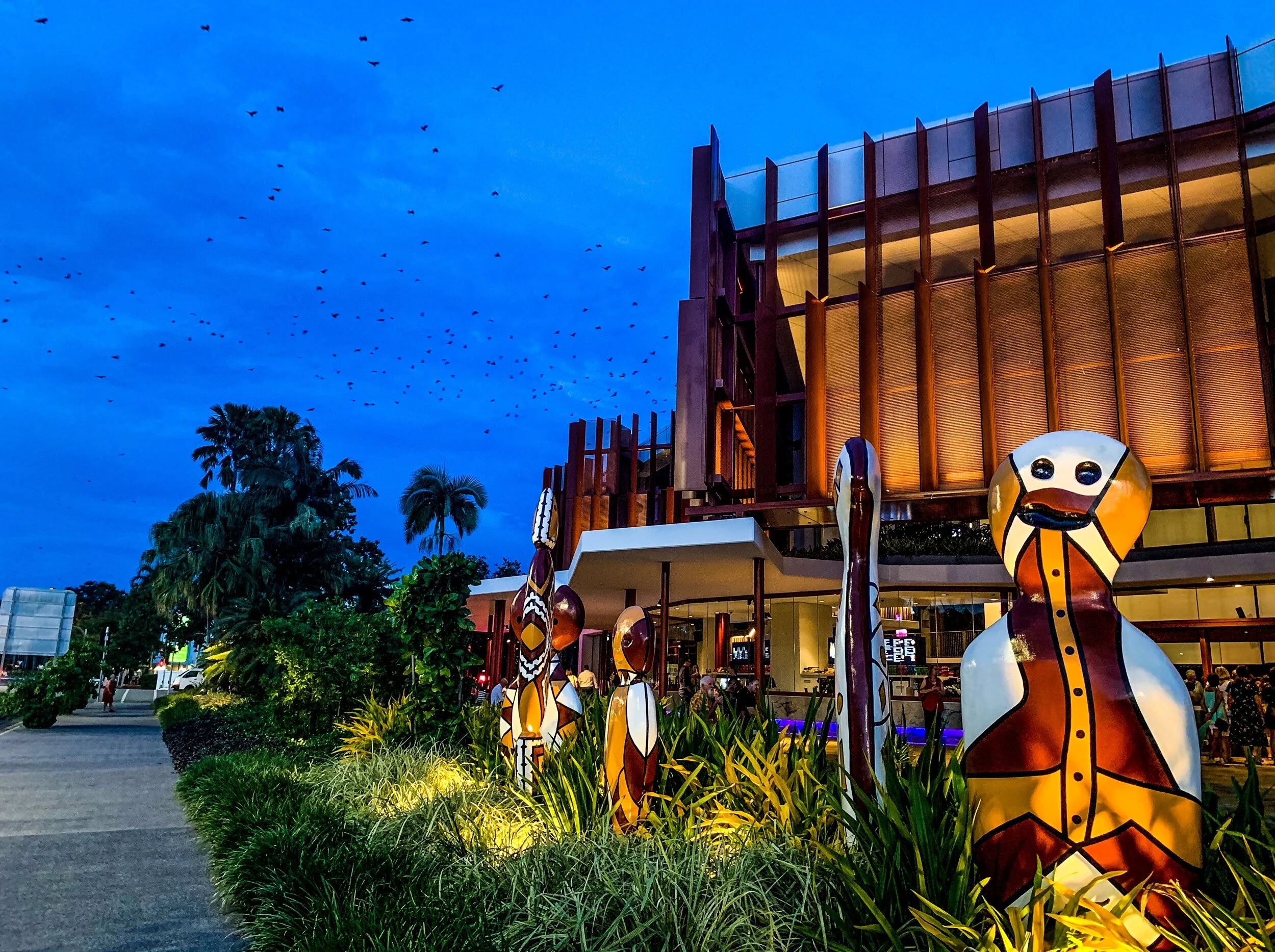 Bats fly by aboriginal themed art in Cairns, Australia