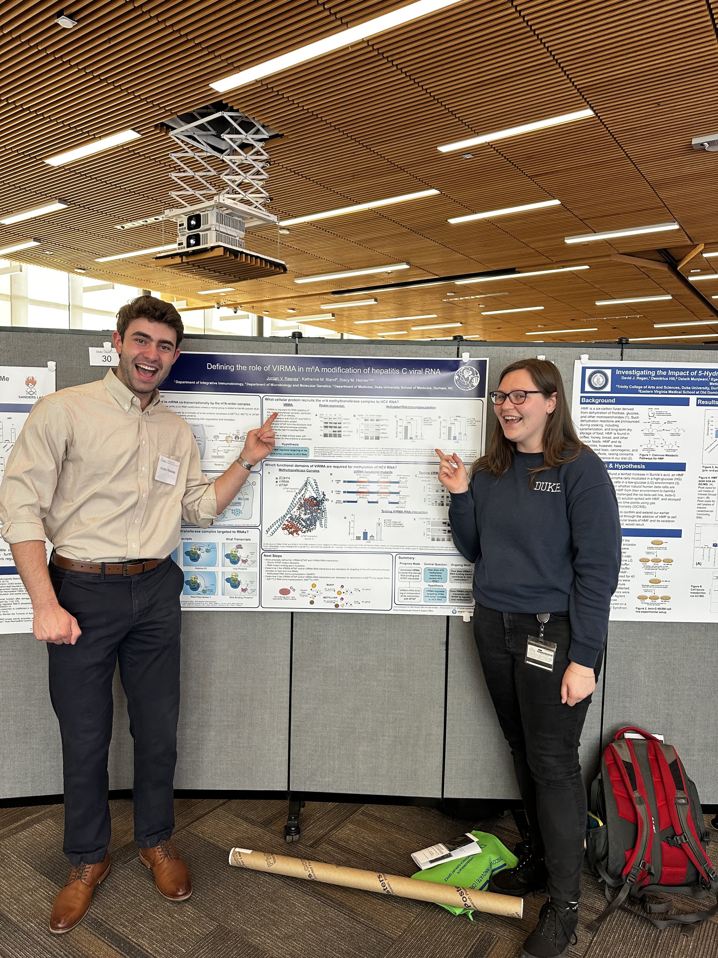 Spring 2025: Jordan presents his poster at the Undergrad research forum along with mentor Kate.