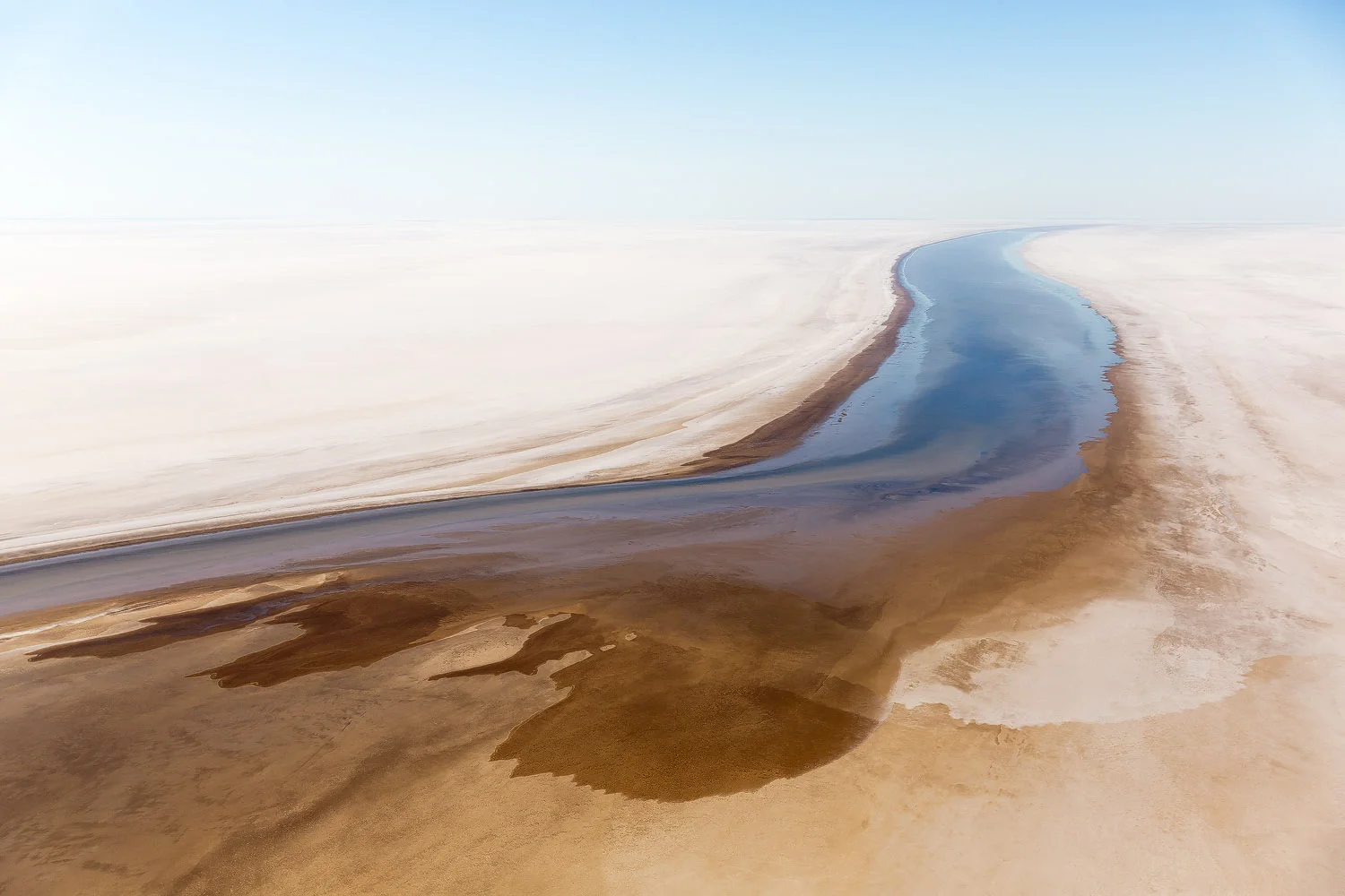 abstract-aerial-photography-blue-river-running-through-white-salt.jpg