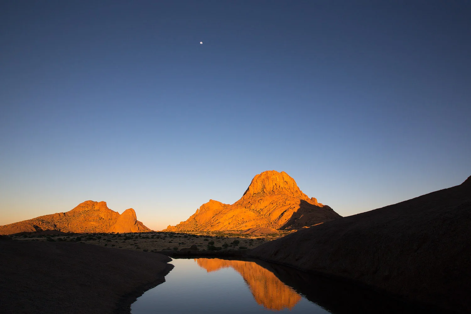 high-altitude-rock-pond-with-moon-reflection.jpg
