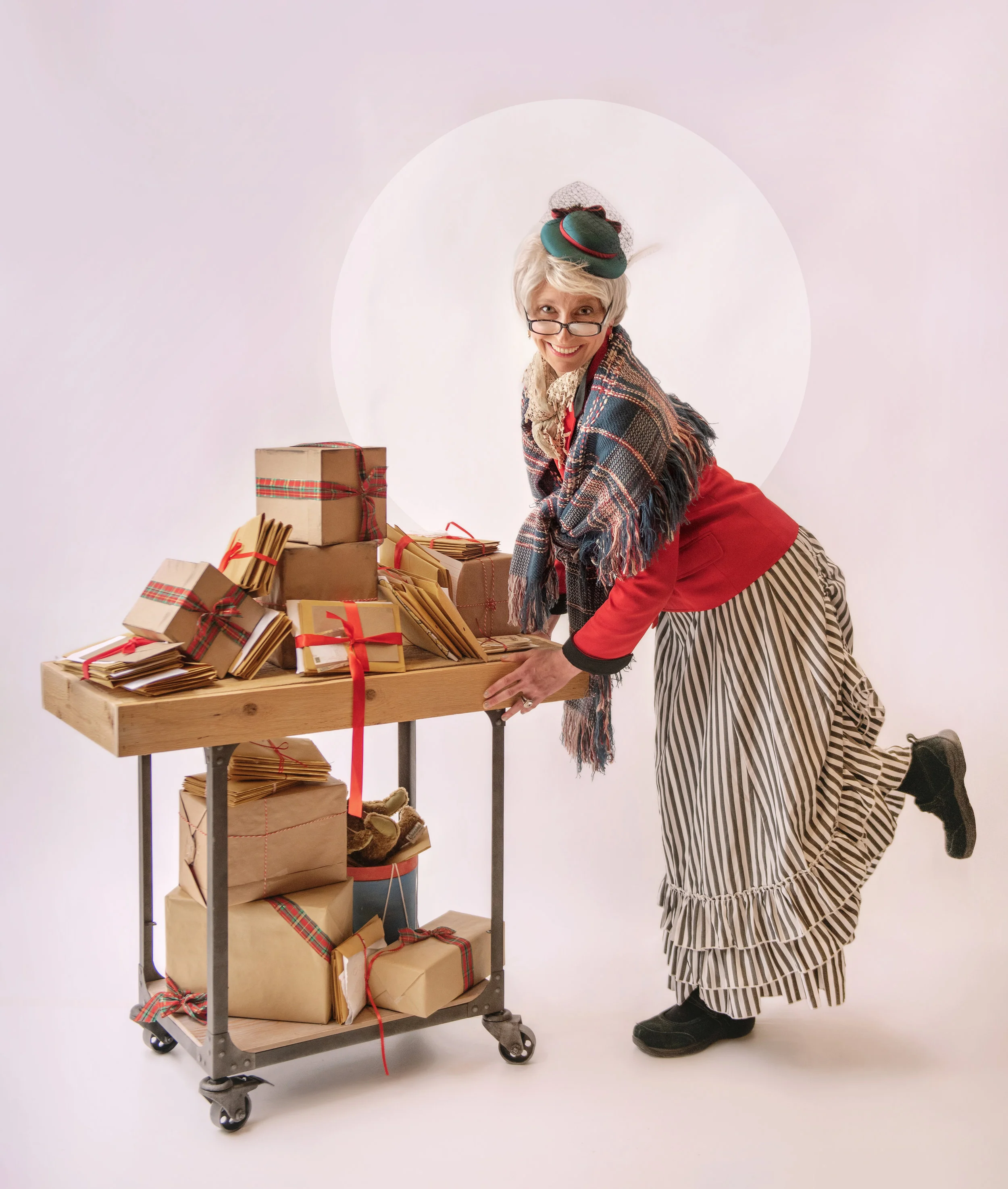 MrsClaus smiling with cart vertical.jpg