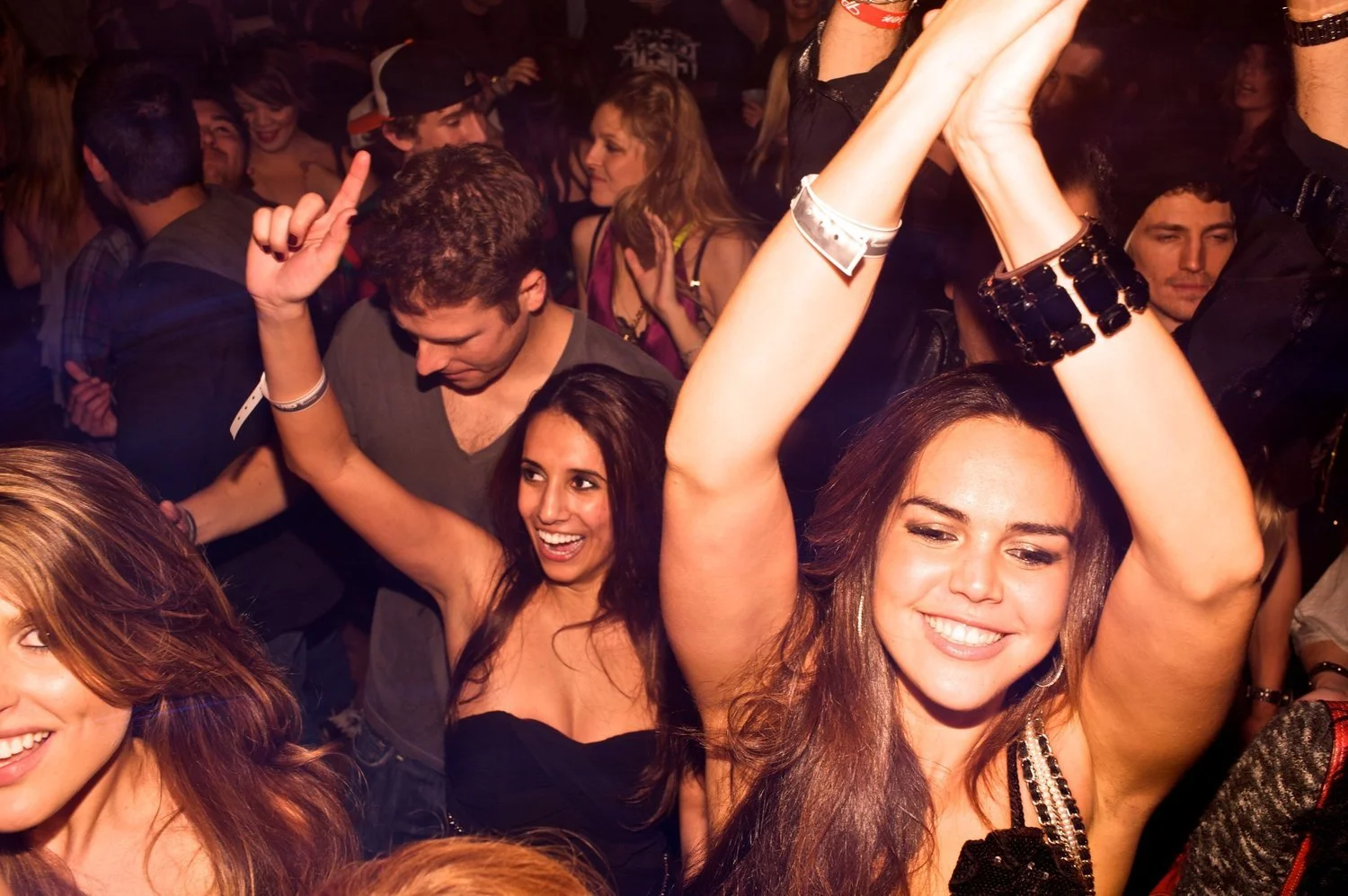 Event Photography: a young energetic crowd give expressive poses for the camera at a corporate event, San Jose, CA. Bay Area