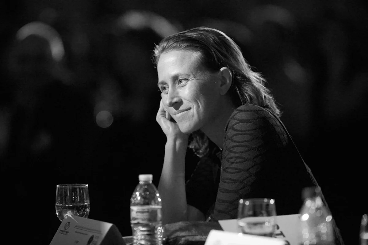 Event Photography: close-up candid of Anne Wojcicki, CEO of 23andMe, with a look of admiration, Palo Alto, Silicon Valley