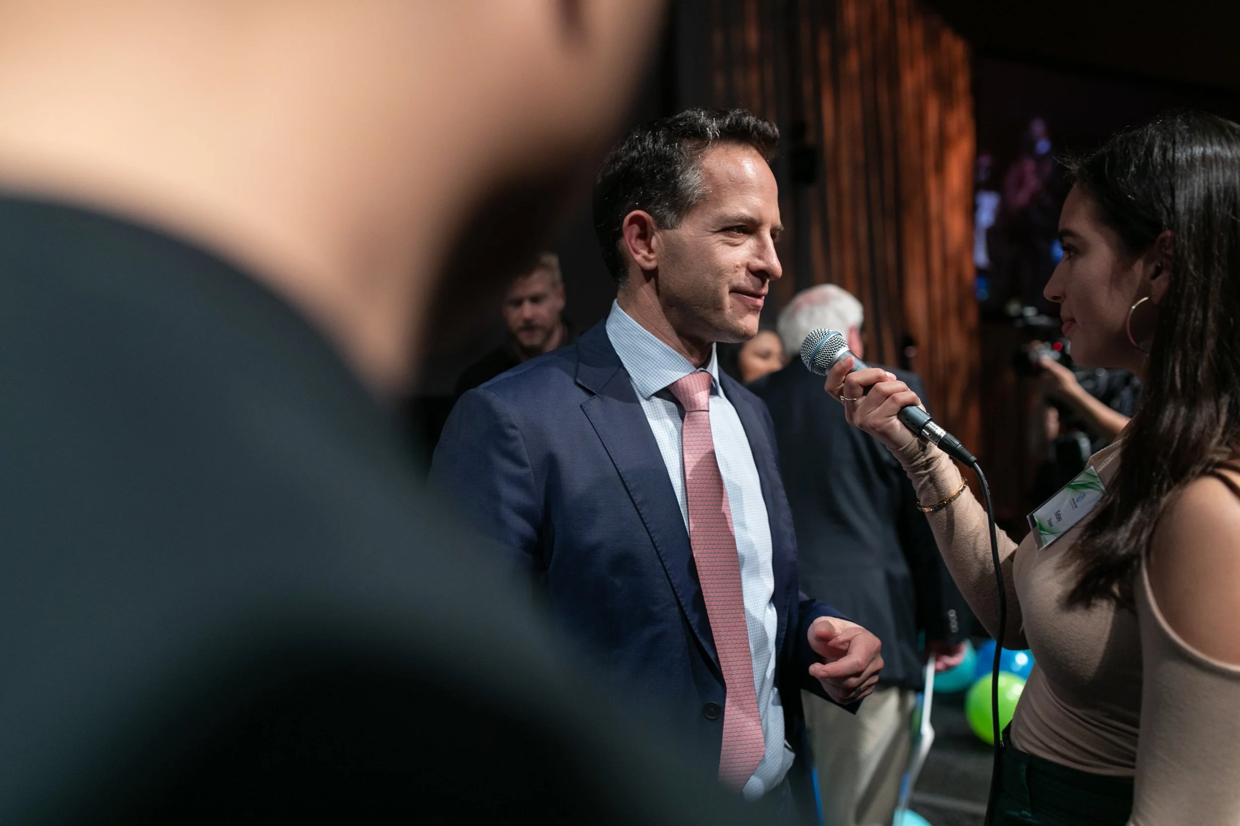 Zander Lurie, CEO of SurveyMonkey, being interviewed at a fund raising gala