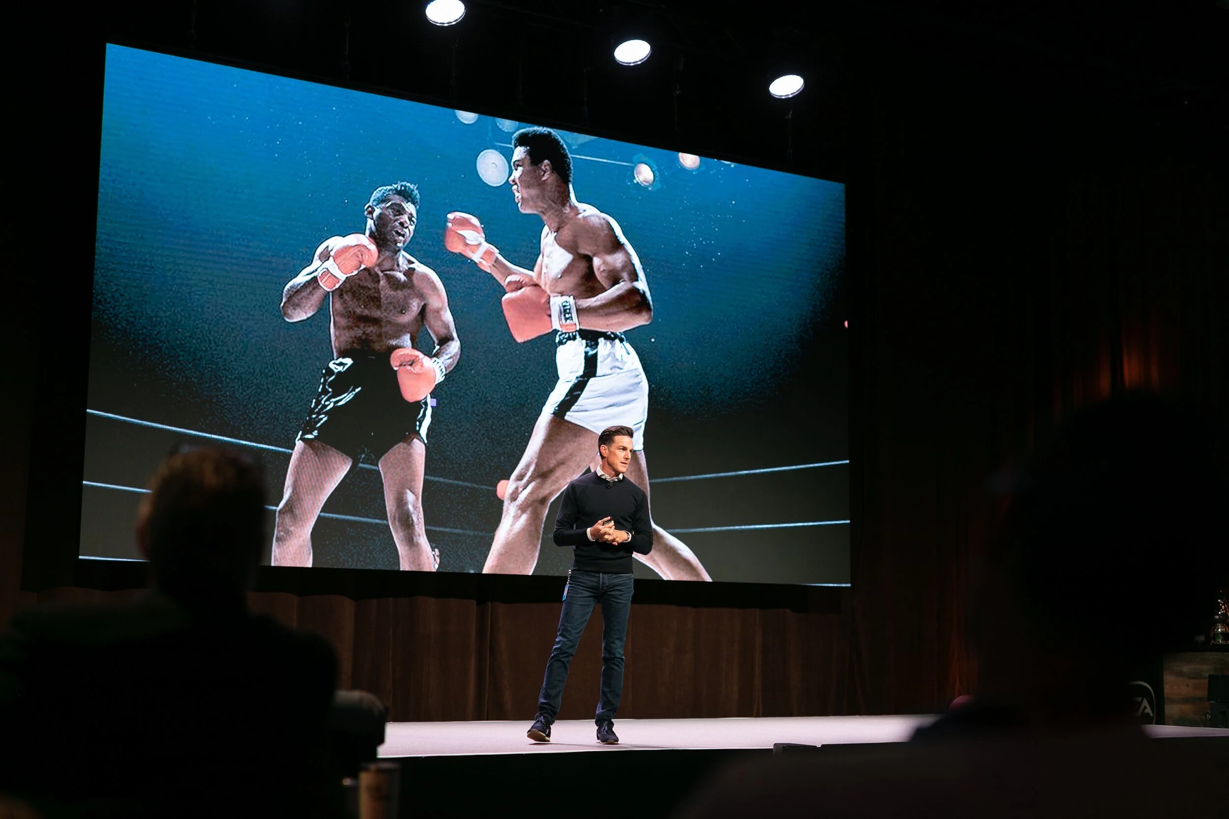 Electronic Arts CEO Andrew Wilson Keynote address. Muhammad Ali is in the background