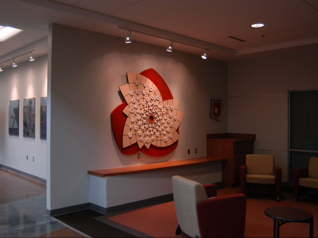  Connection Web: 6’ 4” x 5’ 9” x 2” Baltic birch and cherry wood ply, Delrin, aluminum, Corian, porcelain with decals, steel and polycarbonate locking mechanism :: 2009.  We placed this sculpture in a publicly accessible meeting and waiting area. It 