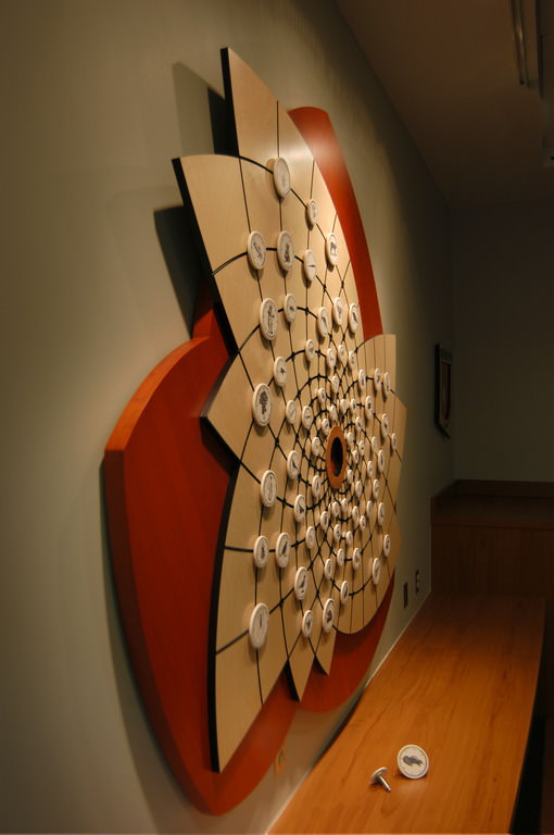  Connection Web: 6’ 4” x 5’ 9” x 2” Baltic birch and cherry wood ply, Delrin, aluminum, Corian, porcelain with decals, steel and polycarbonate locking mechanism :: 2009.  The board can be reconfigured to create an opportunity for temporary art shows 