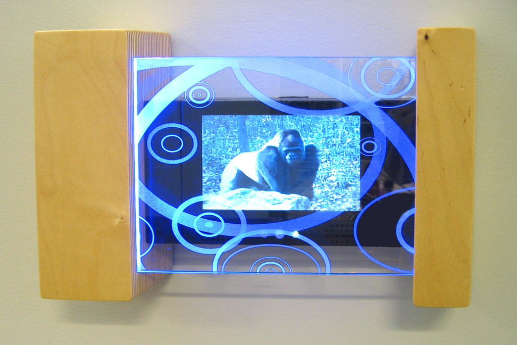  Video Explorers: 1’ 4” x 10” x 3” Baltic birch ply, etched tempered glass, led edge light, solid state media player :: 2009.  The sequences we supplied contain footage from the zoo, sports facilities, nature trails, mounted police stables, family pi