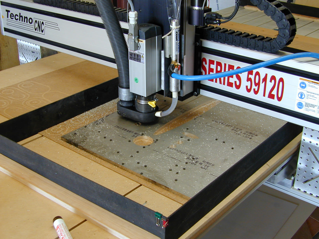  Ripple Effect: 3’ x 6’ x 150’ Acrylic fins, steel, aluminum, sensors, controllers and stepper motors :: 2009.  This image shows a sheet of aluminum on the bed of the CNC, which is cutting parts for the motor mounts. 