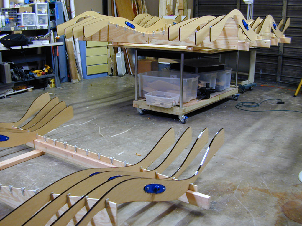  Ripple Effect: 3’ x 6’ x 150’ Acrylic fins, steel, aluminum, sensors, controllers and stepper motors :: 2009.  Here the acrylic fins are fitted with mounting hardware in our workshop. 