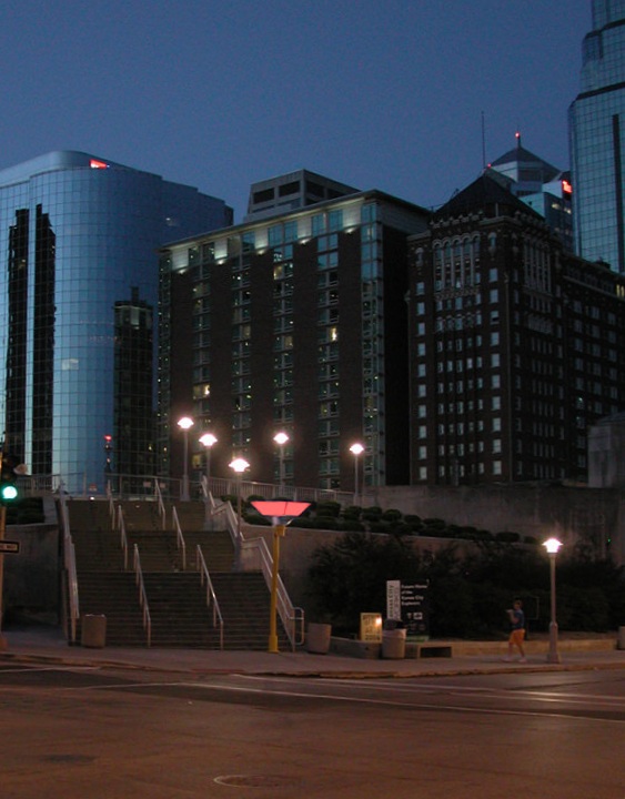  Sky Funnel, downtown Kansas City, MO :: 2006.  The Sky Funnel in front of office buildings, the deep pink-orange of a sunset streaked with clouds. The presence of so much stray light meant that the subtleties of the sky memory of the previous day of