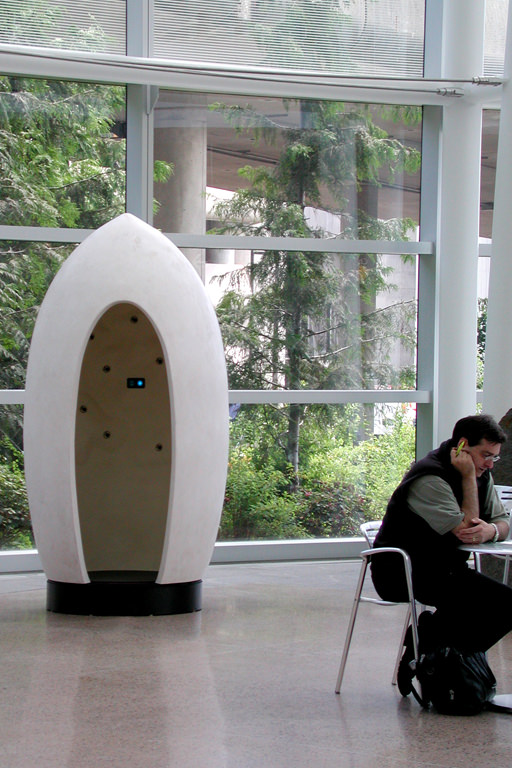  Poetry Machine: 7’ 6” x 4’ x 4’. Expanded foam, Aqua resin, sensors, battery power, microprocessors, computer and sound systems, Seattle, WA :: 2005.  The booth at SeaTac International Airport, close up. In the second programming mode, people can pu