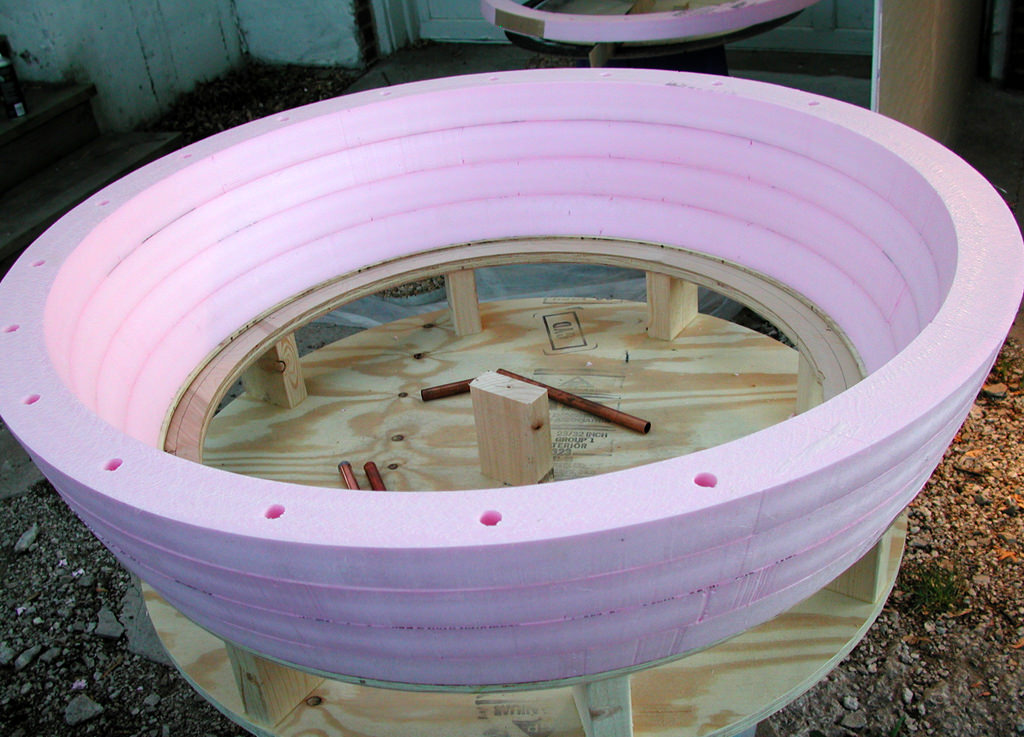  Poetry Machine: 7’ 6” x 4’ x 4’. Expanded foam, Aqua resin, sensors, battery power, microprocessors, computer and sound systems, Seattle, WA :: 2005.  When the discs had been cut into rings, they were glued together. We used lengths of piping to ali