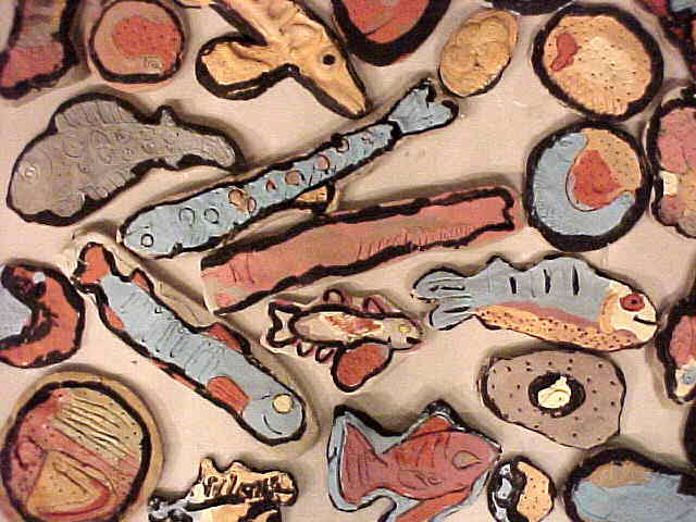  Graham Hill Elementary School, Seattle, WA – Salmon cycle: Teaching component :: 2004.  Eggs and developing salmon, glazed but not fired. These are the elements that were mounted on the wall around the poem line. The process of egg hatch and develop