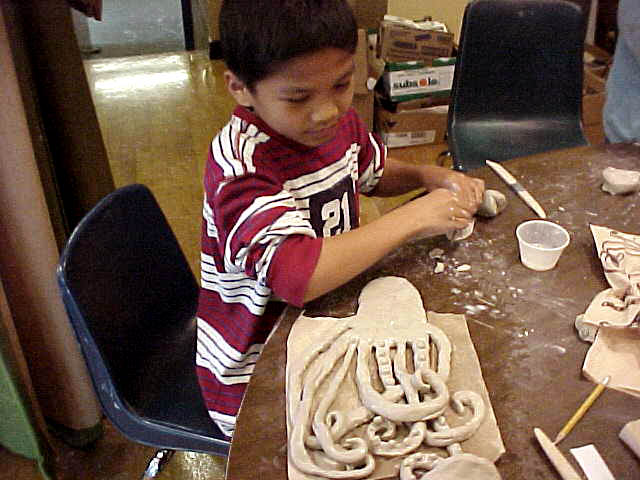  Graham Hill Elementary School, Seattle, WA – Salmon cycle: Teaching component :: 2004.  Making another octopus. We were astonished at how few hand-eye coordination skills most of the students had (some had never learned to use scissors), and at the 