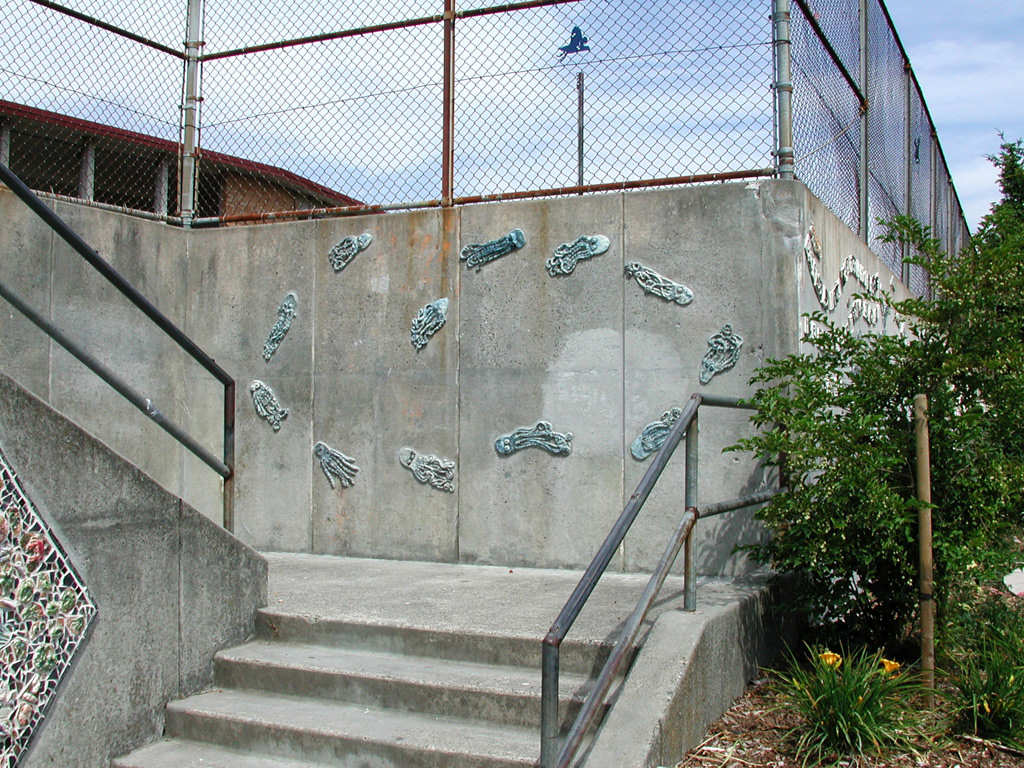  Graham Hill Elementary School, Seattle, WA – Salmon cycle: Octopus school, high fire ceramic, approximately 6’ x 12’ x 1“ :: 2004.  The kids who made these octopi could not believe how great they looked when they were done. We had thought we would j