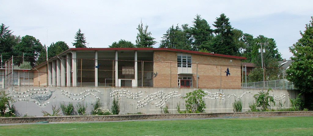  Graham Hill Elementary School, Seattle, WA – Salmon cycle: Poem Line, high fire ceramic, each tile approximately 6” x 6” x 1” :: 2004.  Poem line whole right end with whale, pelican, hawk, duck, sandpipers on the fence above. We really needed the pa