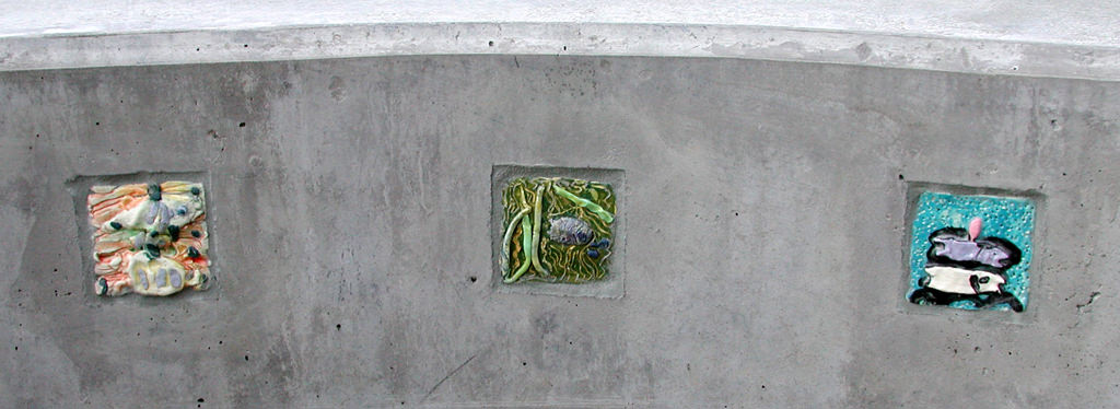  Graham Hill Elementary School, Seattle, WA – Salmon cycle: Freshwater fish tiles, high fire ceramic, each tile approximately 4” x 4” x 2 “ :: 2004.  Tile insets in the talking circle. A couple of classes made tiles to fit into the small recesses tha