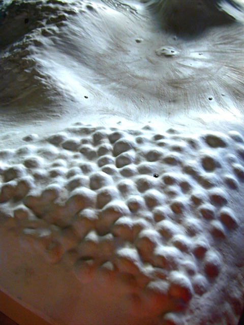  Songlines: detail, Ceramic, steel, photosensors, heat lamps, sound (56 phonemes of the English language), CMA Gallery, Seattle, WA :: 2003.  The textured “landscape” surfaces of the tiles are studded with small infrared photo-sensors, and the room i